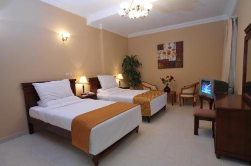 Le Grand Hotel Doha Habitación foto